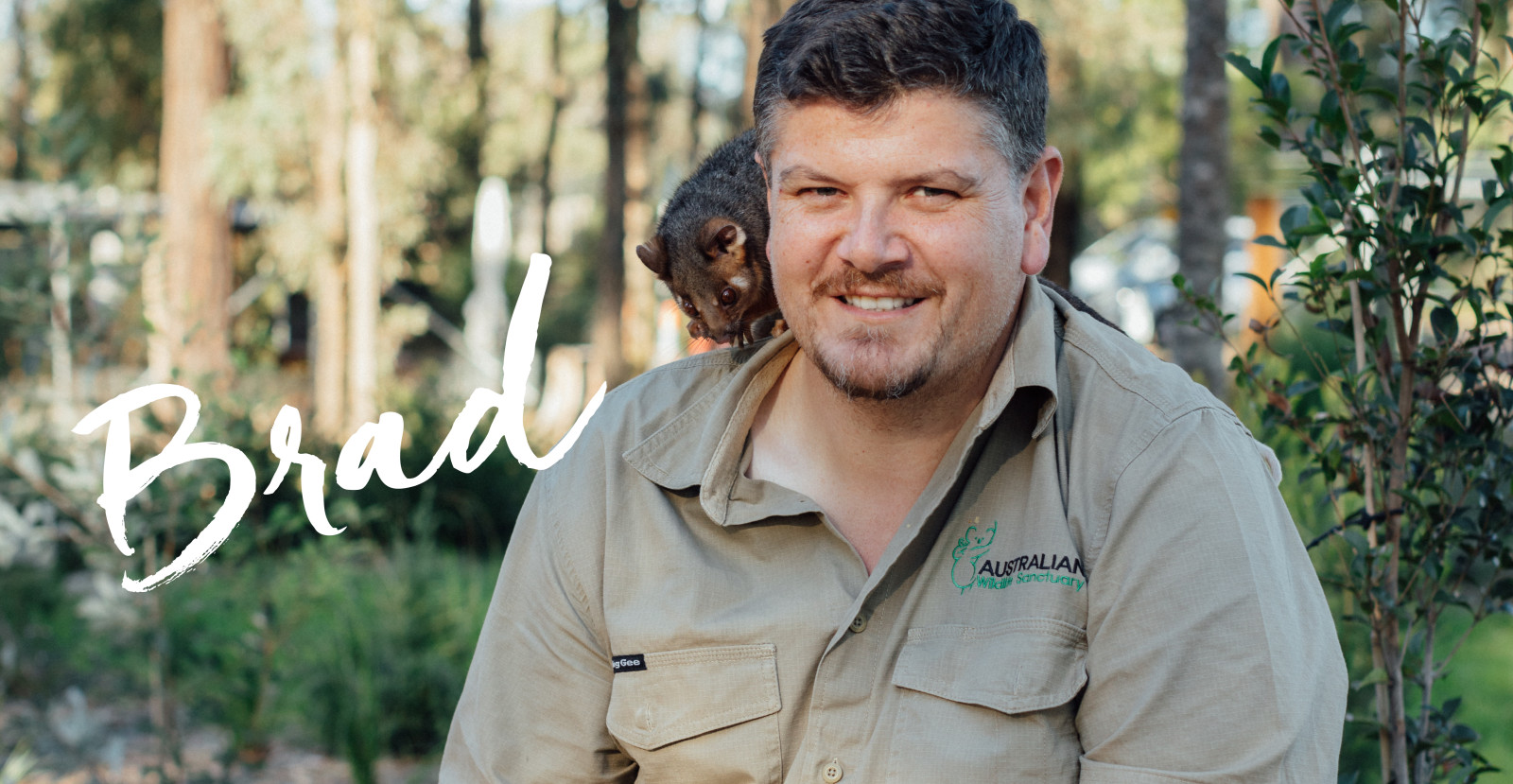 Wildlife Sanctuary Owner posing with possum